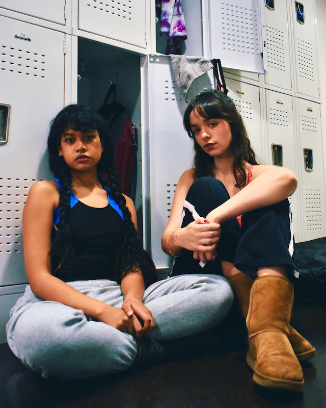 Nuha Jes Izman and Isa Barrett pose in locker room